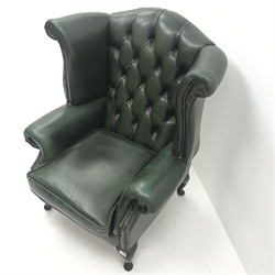 Queen Anne style wing back armchair upholstered in deep buttoned green leather, cabriole legs, W92cm