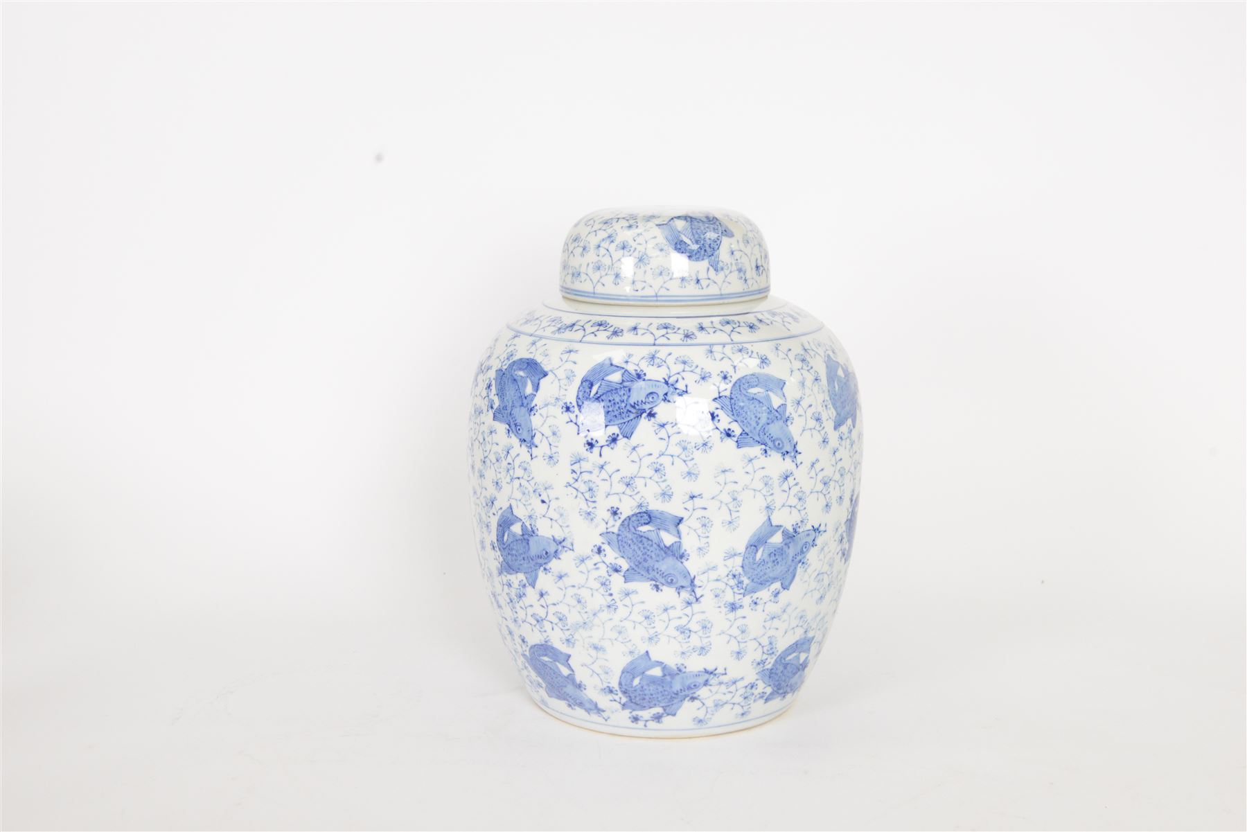 Blue and white ginger jar, decorated in a repetitive pattern of fish swimming amongst dense clusters of aquatic foliage, H40cm