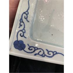 Chinese blue and white planter and stand, each of square slightly tapering and flared form, the planter decorated with two dragons and blossoming peonies, between stylised borders, the stand decorated with flower heads and vines, planter H30cm W29cm, stand H7cm D28.5cm