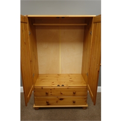  Pine tallboy fitted with two cupboards and two drawers, W87cm, D48cm, H140cm  