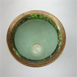 Wedgwood Fairyland Lustre vase, designed by Daisy Makeig Jones, of baluster form decorated with the Imps on a Bridge pattern, painted with a procession of imps crossing a bridge set within a fantasy landscape, heightened with gilt detail throughout, with printed and painted marks beneath, H22.5cm