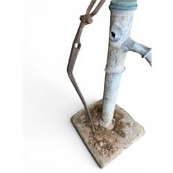 Georgian period lead garden water pump, with iron handle, set in square stone base