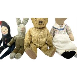 1950's teddy bear with jointed limbs, revolving head, wood filled body, stitched nose and mouth, applied glass eyes and foot pads, together with a quantity of handmade soft toy rabbits and penguins. 