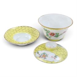 Famille jaune rice bowl, cover, and saucer, decorated with a bird in a blossoming branch, H10cm