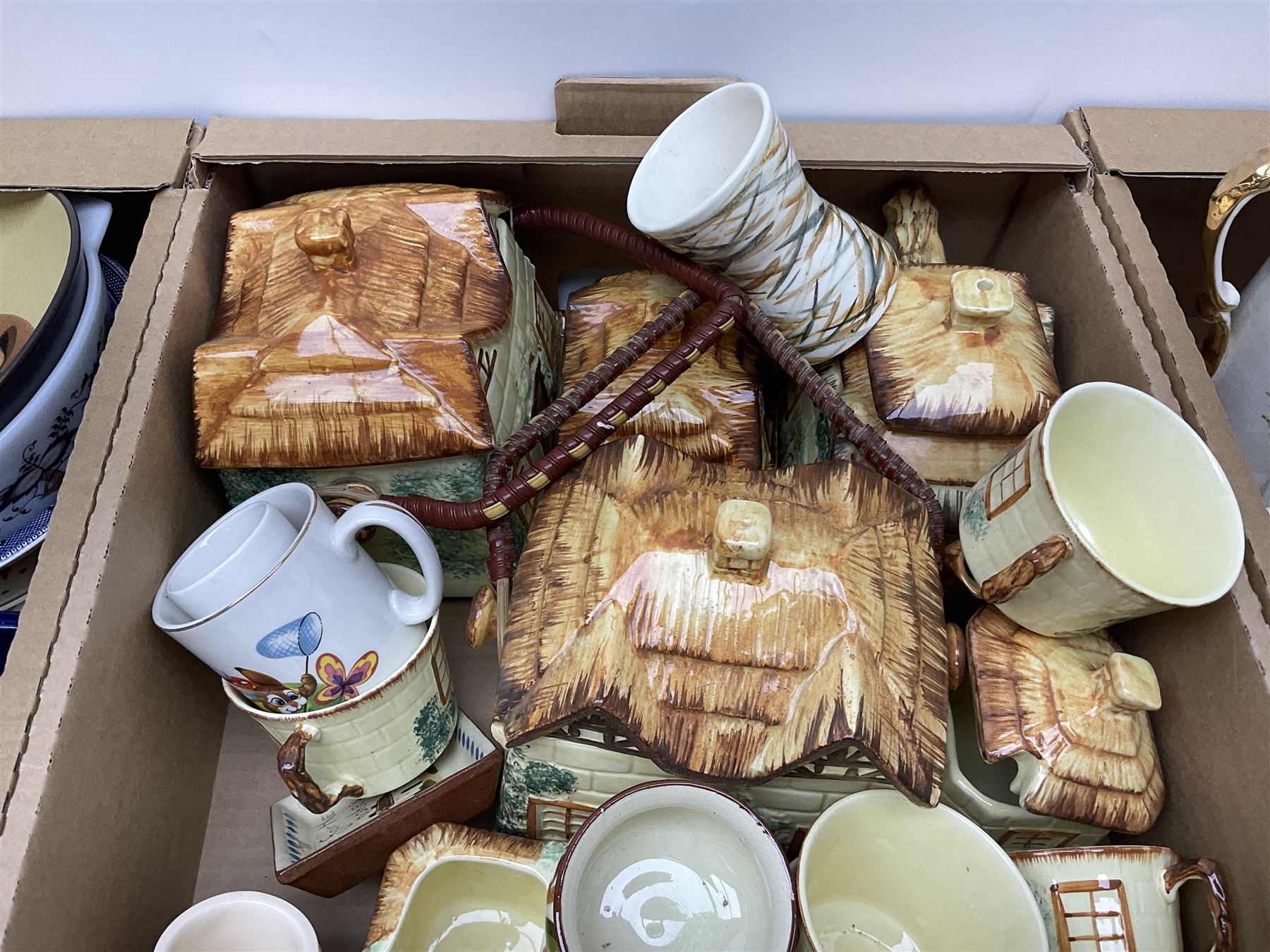 Two Poole Pottery dinner plates and a meat plate, four Copeland Spode Bermuda pattern dinner plates, Sadler jug, Keele St Pottery cottage tea wares, Torquay Motto ware, blue and white jug and bowl, two large planters and other ceramics, etc, in four boxes 