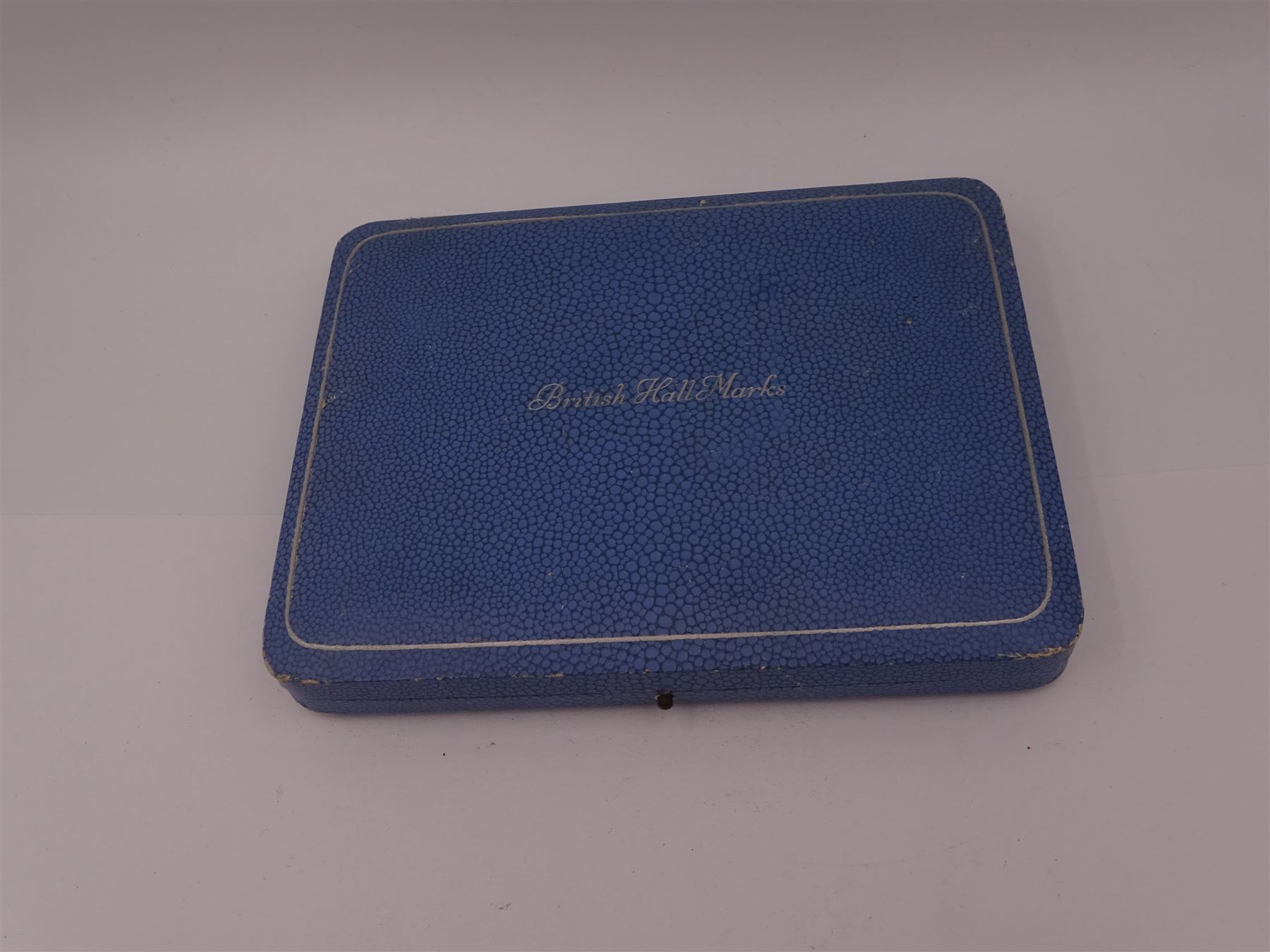 Set of six 1930s silver 'British Hallmarks' spoons by Roberts & Belk Ltd, each depicting a different British hallmark, dated 1935, in fitted case