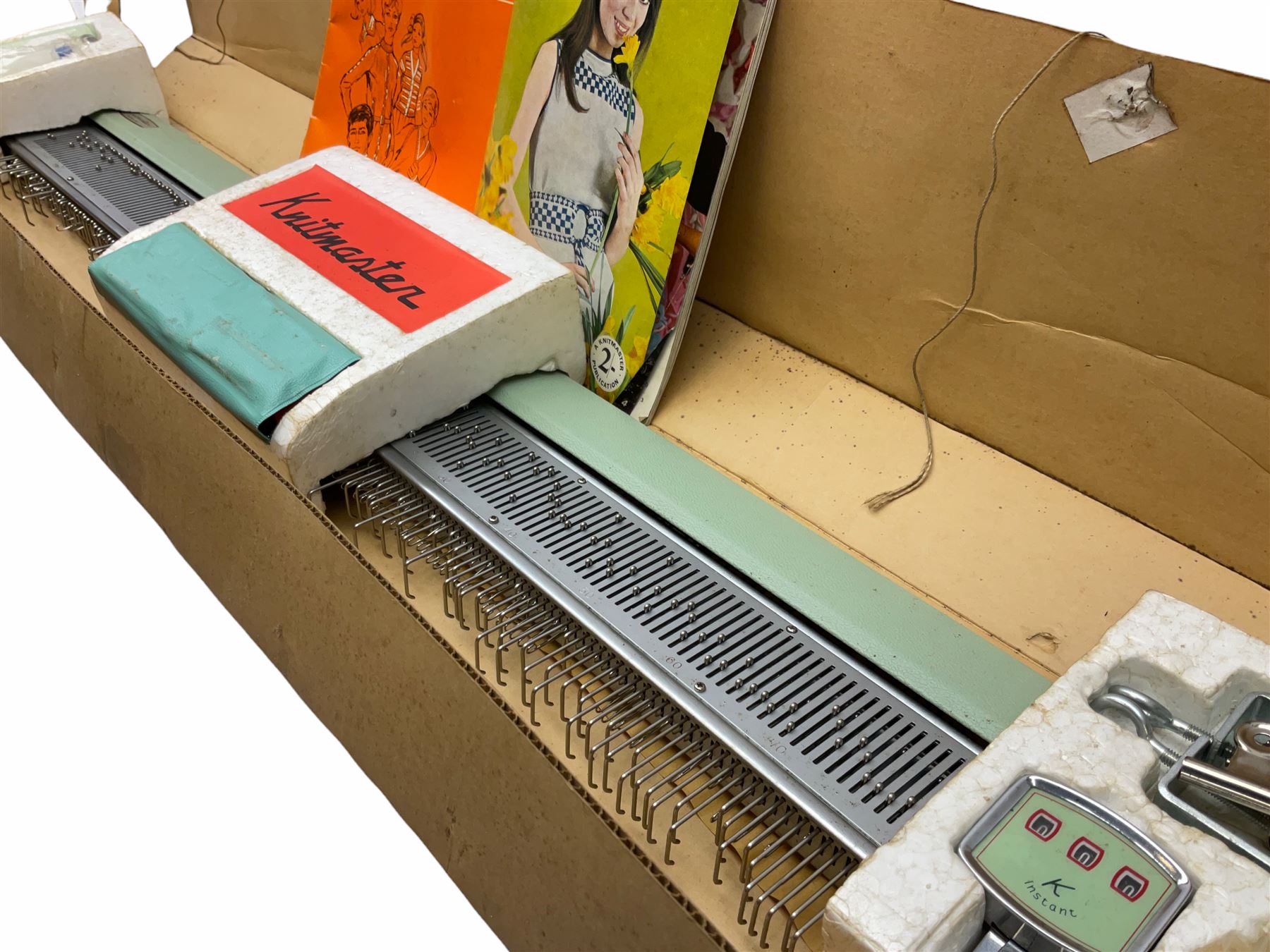 Underwood manual typewriter with original cover and Knitmaster Knitting machine in original box with instructions. 