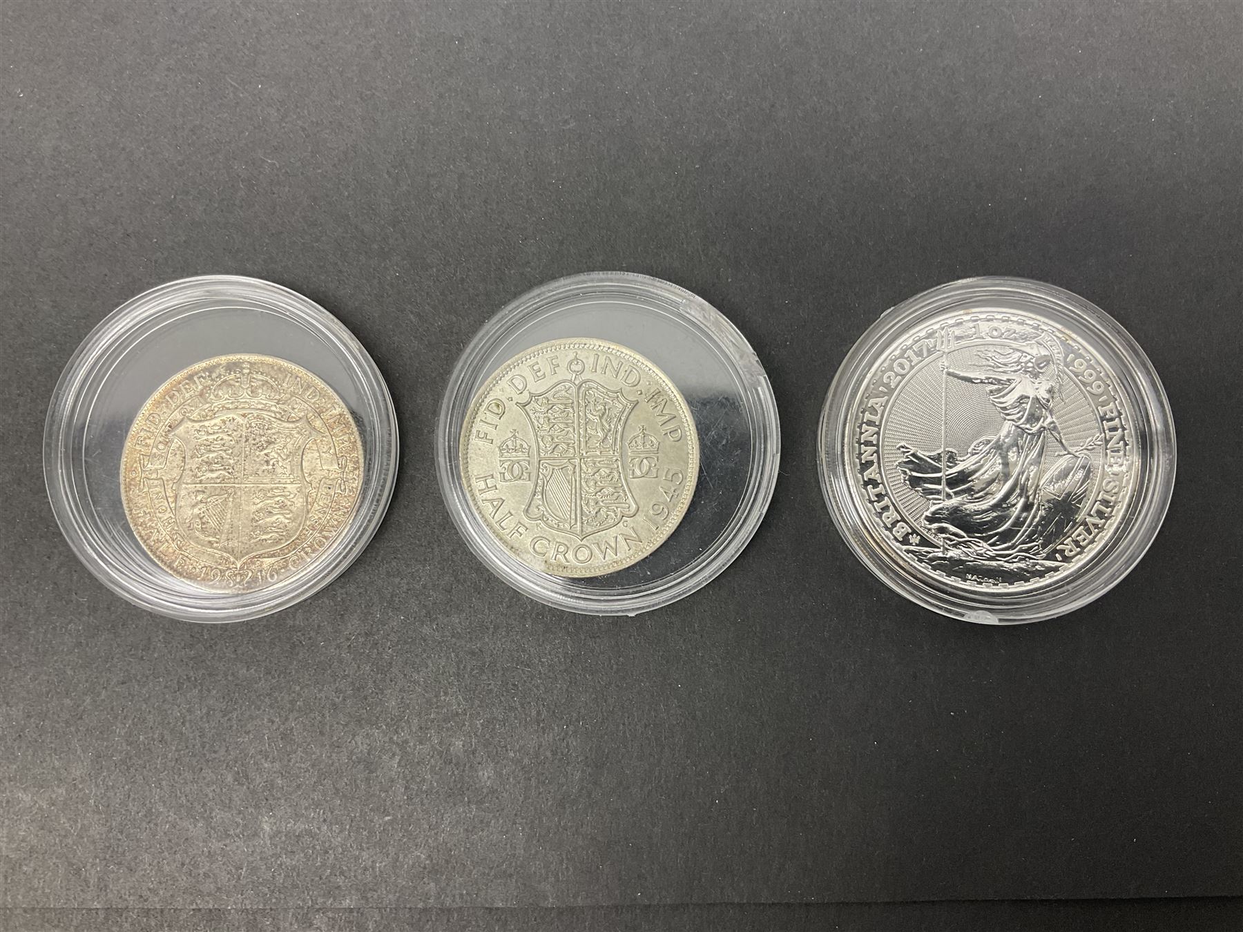 Queen Elizabeth II 2017 one ounce fine silver Britannia coin, The Royal Mint 2013 fine silver twenty pound coin on card, King George VI 1945 halfcrown and King George V 1916 halfcrown