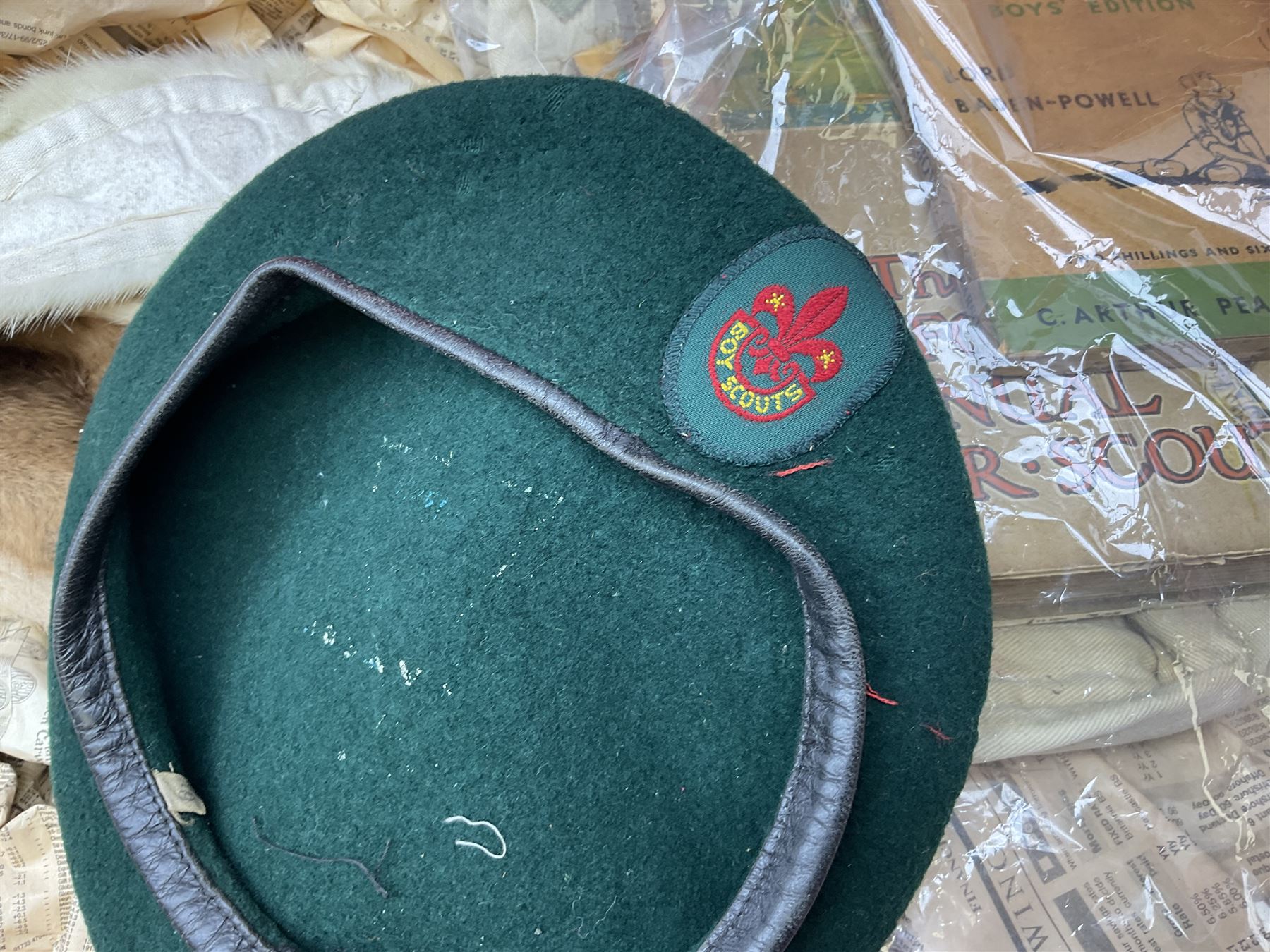 Scout uniform and scout books, together with a vintage suitcase, and mink stoles 