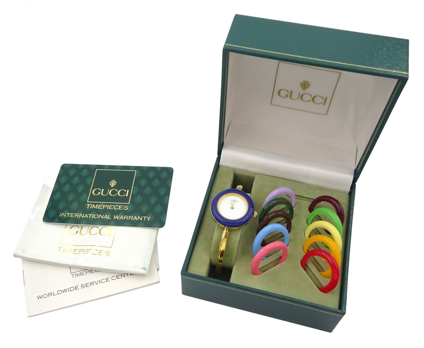 Gucci ladies gold-plated quartz wristwatch, Ref. 11/12.2, with eleven interchangeable coloured ring bezels, boxed with warranty card dated 1997 
