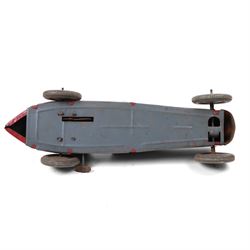 Mettoy tinplate clockwork racing car, the boat tailed red body with lithographed details, racing no. 7, with Dunlop Fort tyres, driver and key, H8cm, L32cm