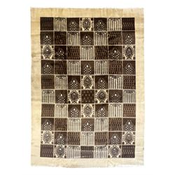 Mid-20th century Persian Bakhtiari rug, ivory ground with alternating dark brown and ivory panels featuring geometric and floral designs, bordered by a plain ivory band