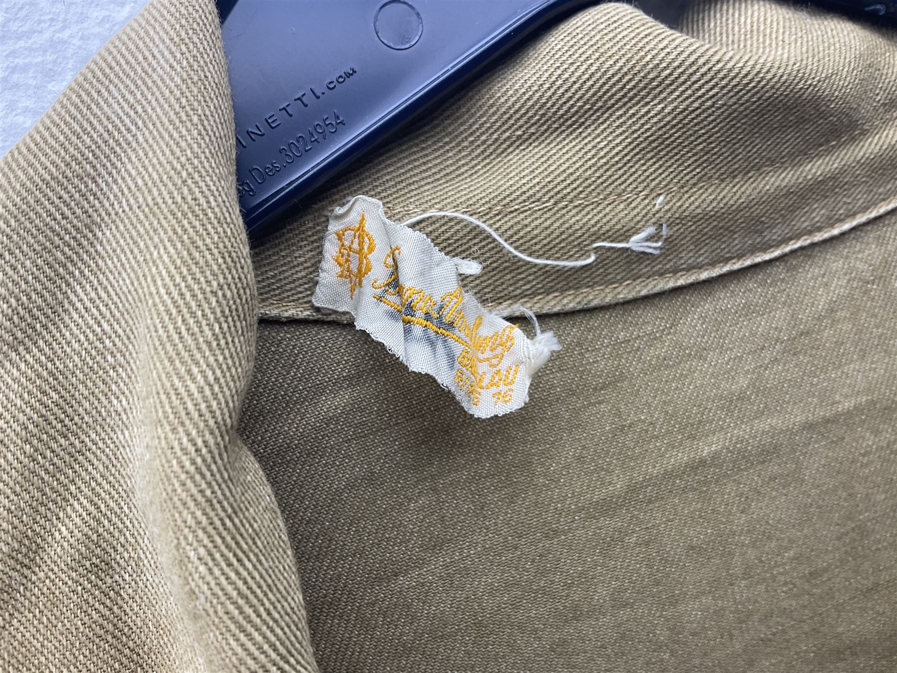 1930s Hitler Youth brown shirt, long length with two pockets, bears triangular badge 'Nord Nordsee'