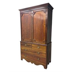 George III mahogany linen press cupboard, projecting moulded cornice over two panelled doors, the interior fitted with two slides and shelf, two short and two long drawers below, shaped apron over bracket feet 
