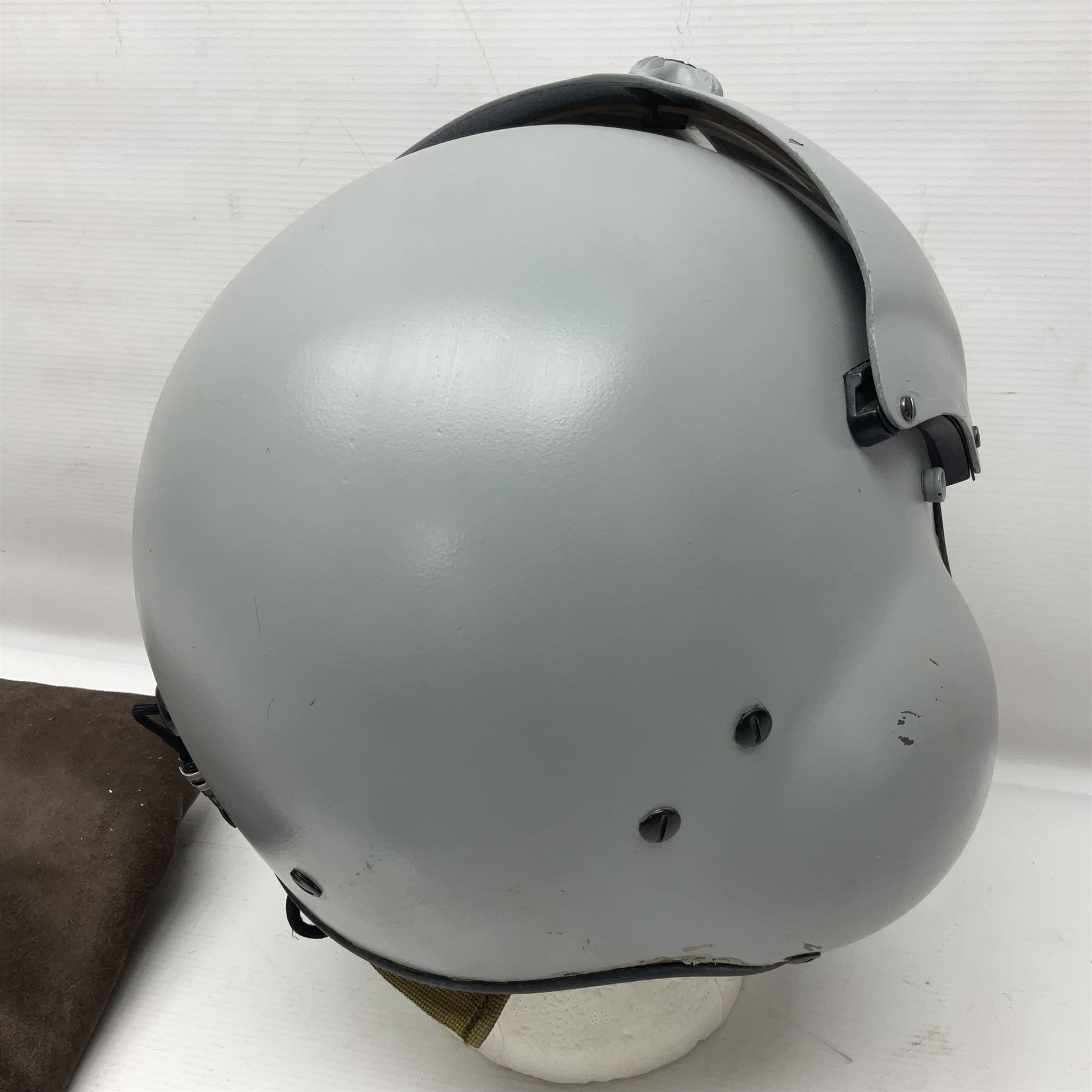 Silver grey SPH-4B Flight Helmet as used by helicopter pilots in the USAF and US Army in the 1990s; made of epoxy resin reinforced fibreglass; fitted with clear and tinted visors and complete with an M-87A/AIC boom mike; original condition and bench tested.