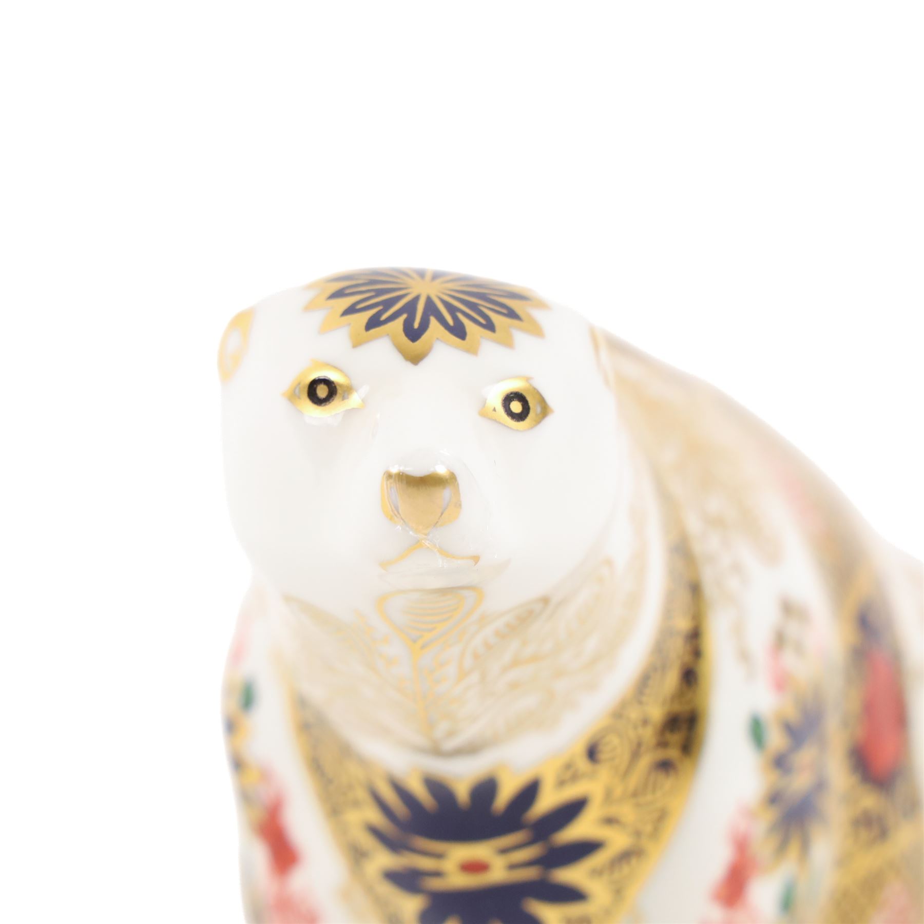 Two Royal Crown Derby paperweights comprising Imari Polar Bear with gold stopper and Sleeping Dormouse, with gold stopper  