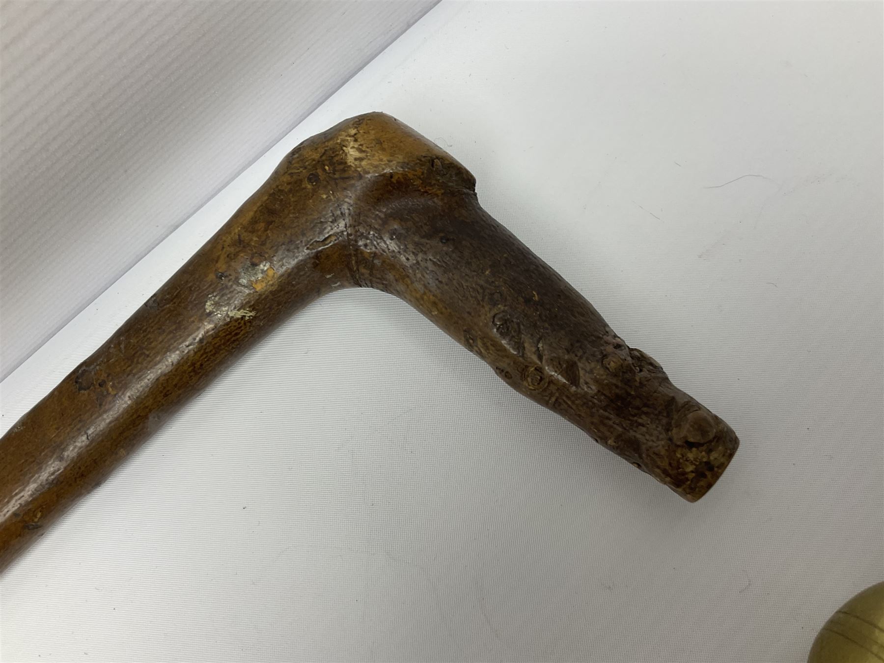 Four wooden walking canes, including a carved mahogany snooker cue example, tallest H86cm