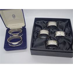 Set of four modern silver napkin rings, of plain oval form, hallmarked W I Broadway & Co, Birmingham 2007, in fitted box, together with a further pair of modern silver napkin rings, of similar form, hallmarked Ari D Norman, London 1999, in fitted case, approximate total silver weight 3.32 ozt (103.4 grams)