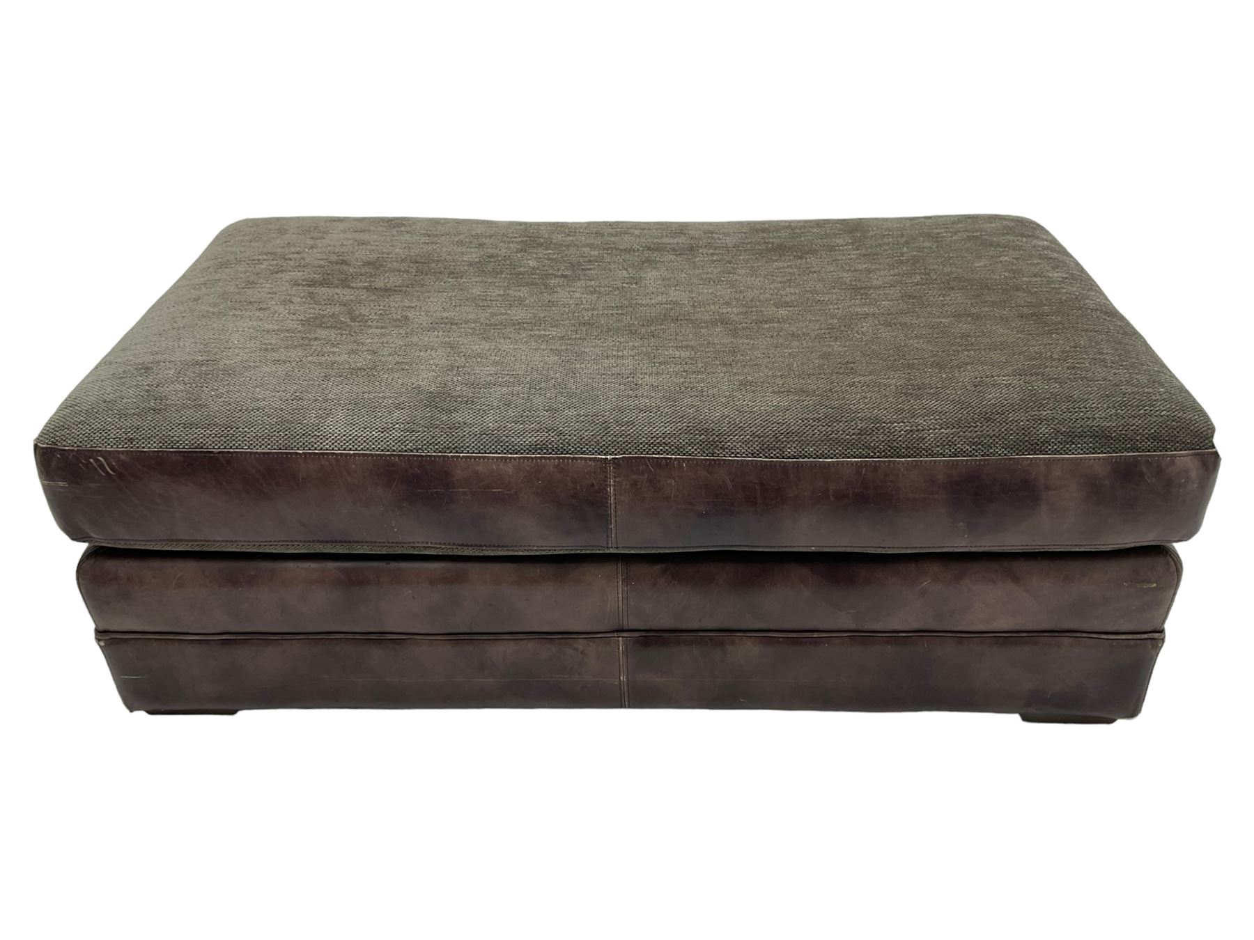 Large Knole design three-seat sofa upholstered in brown leather with scatter cushions upholstered in contrasting striped and Union Jack patterned fabric, on block feet (W210cm, H100cm, D102cm); together with matching rectangular footstool (135cm x 75cm, H45cm)