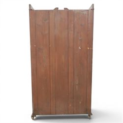 Edwardian walnut bookcase, fitted with two full height glazed doors, inlaid detail with checkered motif, adjustable shelves