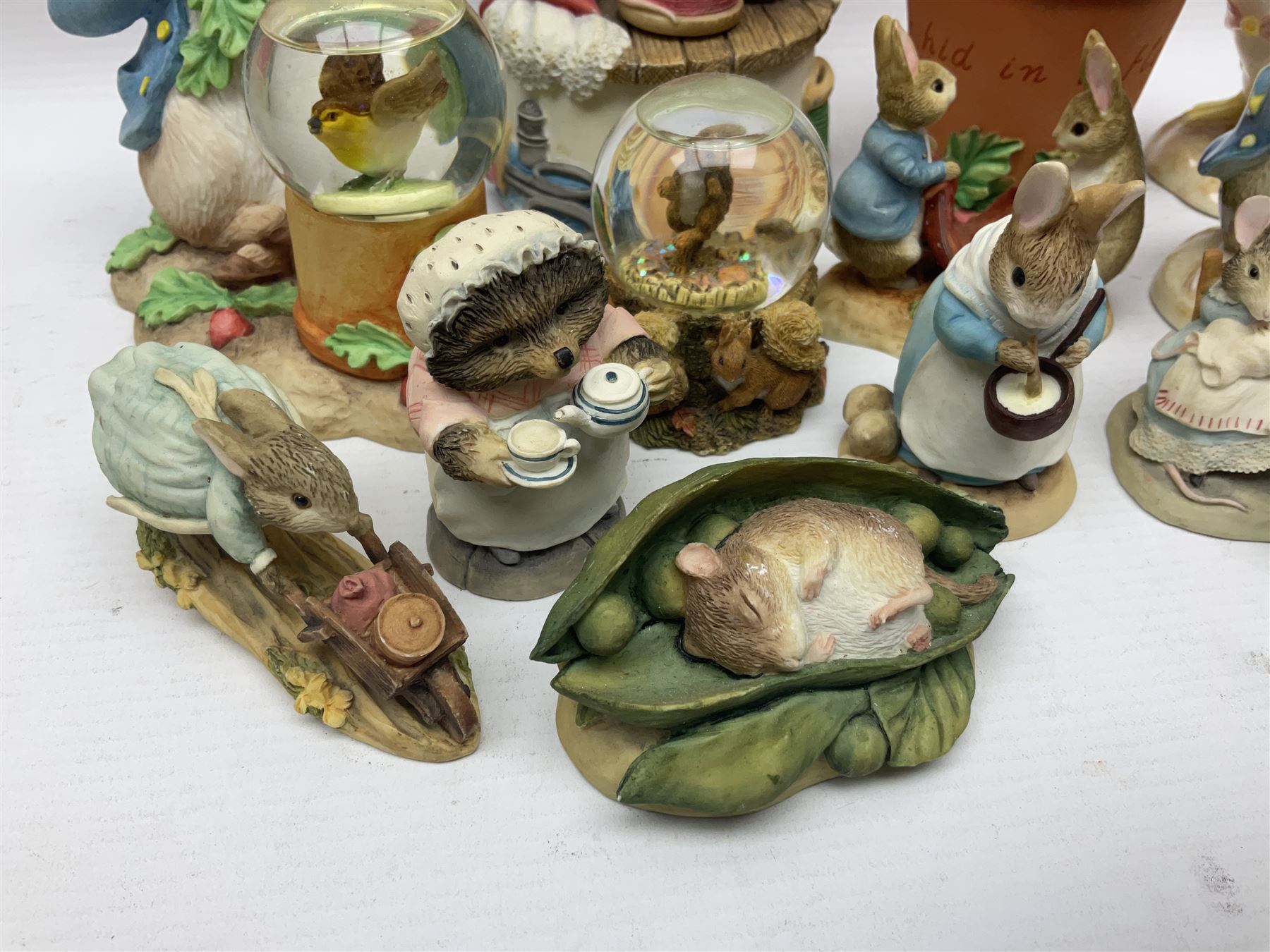 Twelve Border Fine Arts The World of Beatrix Potter and Peter Rabbit Collection figures, including Musical Tailor of Gloucester, Peter Rabbit with Miniature Waterball, Peter Hid in a Flowerpot trinket box, Jemima Puddle Duck with Herbs and Gentleman Mouse, etc