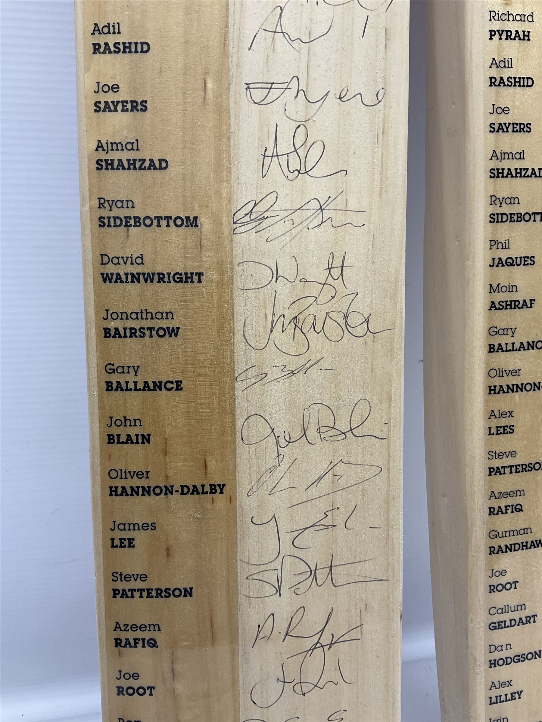 Two signed Yorkshire County cricket bats, from 2011 and 2012 seasons, bearing signatures including Adil Rashid, Andrew Gale, Ryan Sidebottom, Gary Ballance etc