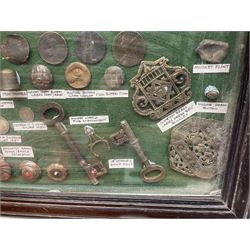 Collection of metal detecting finds and antiquities, housed on five display boards and some loose, to include coins, keys, axe head etc 