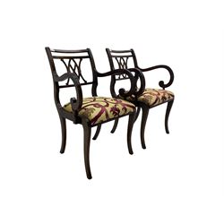 Regency design mahogany twin pedestal dining table, rectangular top with reeded edge, acanthus carved turned column terminating in reeded tripod base with hairy paw feet and castors (W172cm D92cm H75cm) and set eight (6+2) Regency design mahogany dining chairs, pierced back with scroll design, seat upholstered in patterned laurel green fabric, raised on reeded sabre supports (W48cm H88cm)