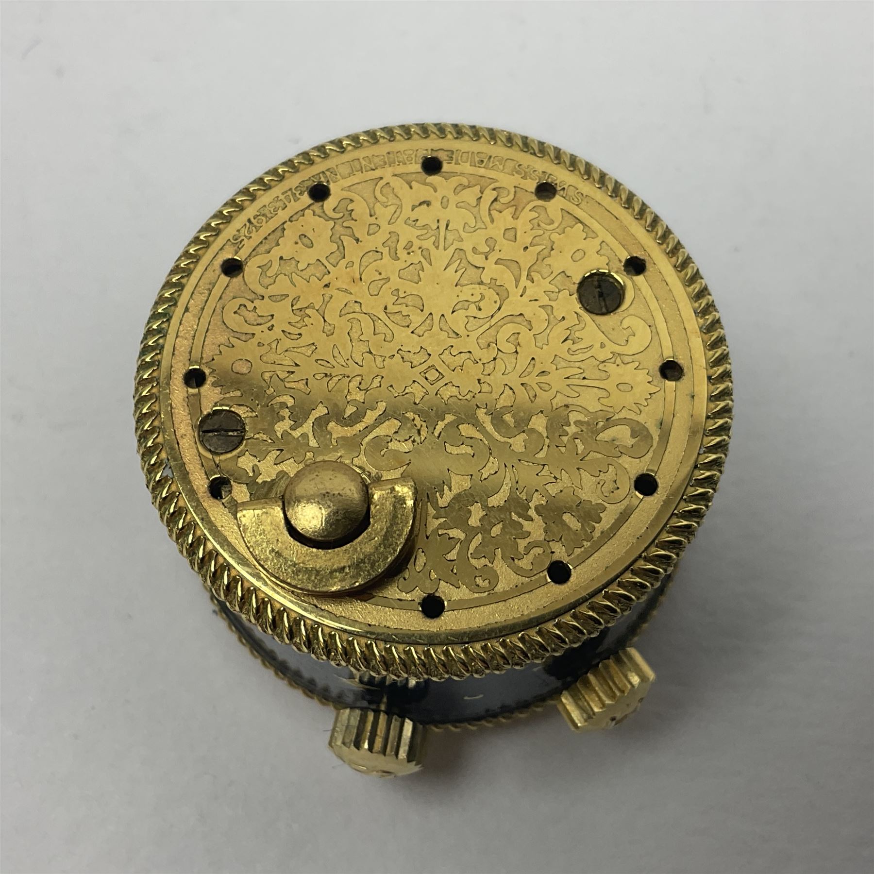 Bueche Girod silver-gilt and enamel novelty miniature clock, with a band of gilt moon and star decoration upon a deep blue enamel ground, with enamel and gilt foliate dial, with musical mechanism playing happy birthday, D2.7cm, in suede pouch