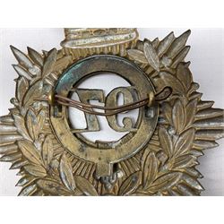 Victorian 1878-1881 97th Foot Helmet Plate with Victorian crown over brass backing star with laurel wreath and belted circlet containing loose fitting brass central plate `97` and two rear fixing lugs.