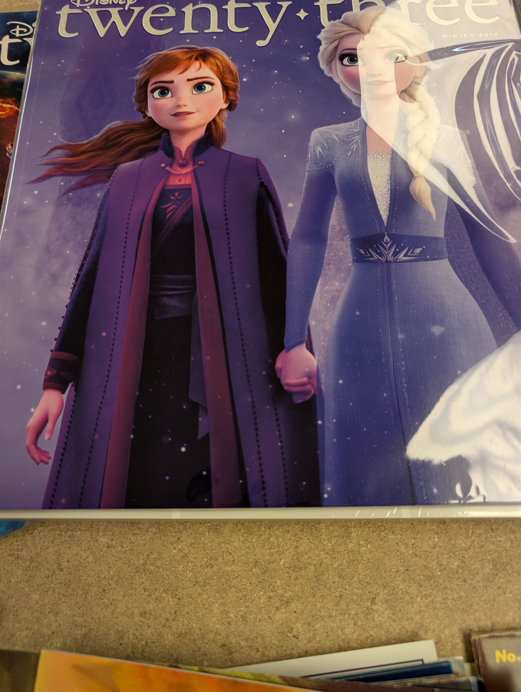 Collection of Disney memorabilia and ephemera, including Walt Disney Treasures DVD, two Disney Villains mugs, enamel pins, Mickey Mouse D23 fan club pack, Disney Twenty-Three magazines, Sketches magazines, etc