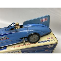 Schylling Collector Series clockwork tin-plate Sir Ian's Bluebird Land Speed Record Car with key and paperwork No.006080; boxed; and clockwork silvered tin-plate model of an 0-6-0 locomotive; unboxed (2)