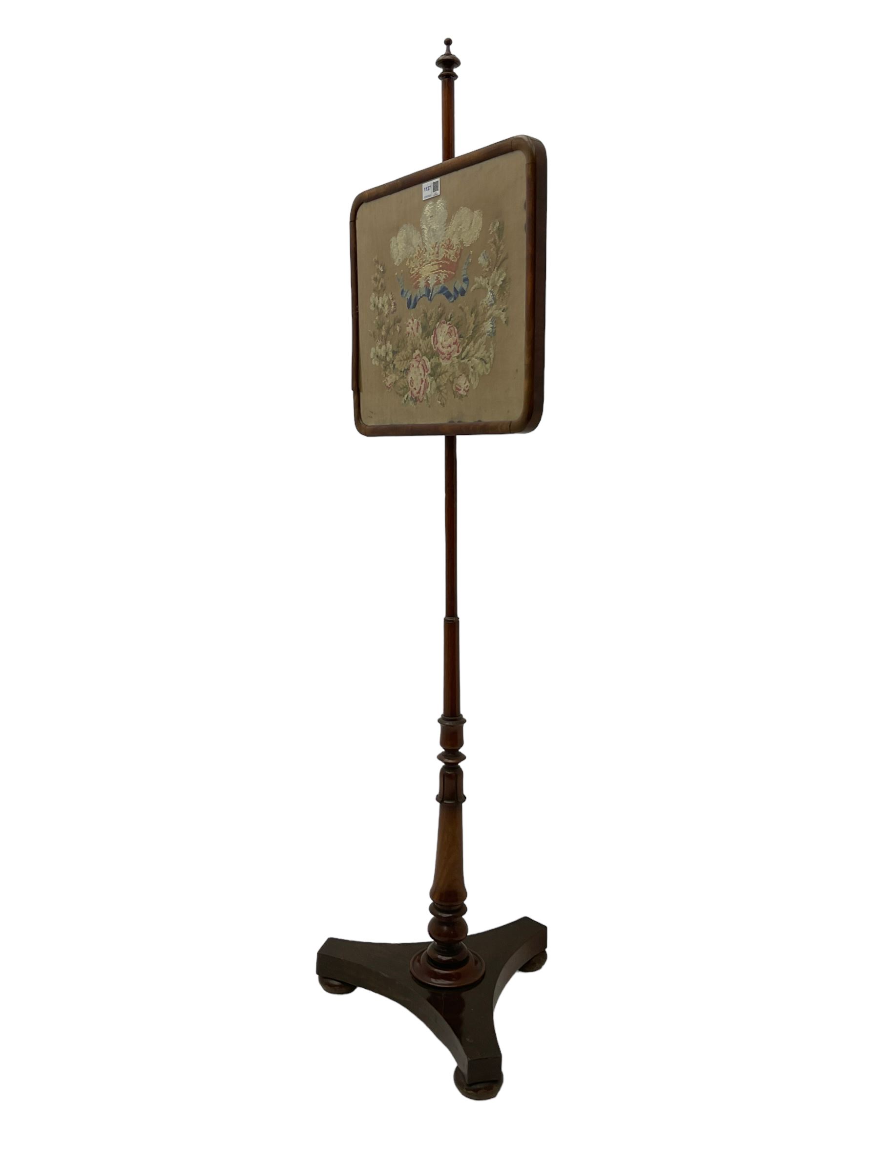Victorian mahogany pole screen, with needlework panel depicting the Prince of Wales feathers and floral garland, vasiform pole with lappet decoration, on a concaved triangular platform with compressed bun feet