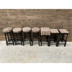 Seven tall bar stools with upholstered seat