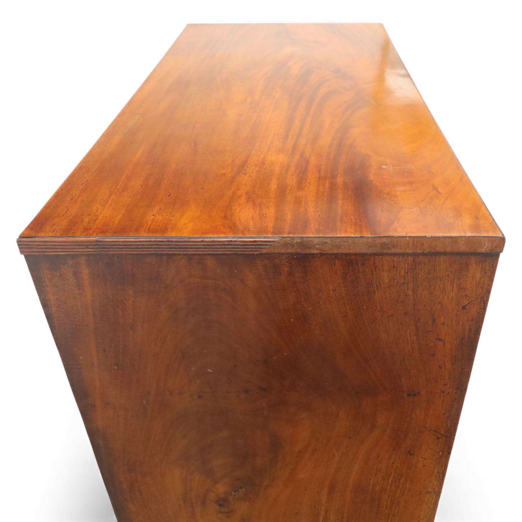 Early 19th century mahogany secretaire chest, the rectangular top over a fall-front fitted with pigeonholes and small drawers, above two long drawers with turned wooden knobs, upon swept bracket feet
