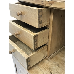 Early 20th century pine kitchen cupboard, raised glazed cabinets with drawers, lower section fitted with two drawers and panelled double cupboard, turned feet,  W127cm, H195cm, D62cm