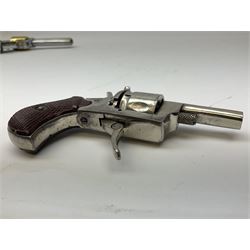 Early 20th century Flobert 5mm blank firing revolver with six-shot chamber, top venting, nickel plated with folding trigger No.118 L12.5cm overall; replica non-firing 'British Bulldog' revolver; and Windproof gas lighter inscribed 'Revolver-99 Spring and Autumn' in holster marked 'Star-Line'