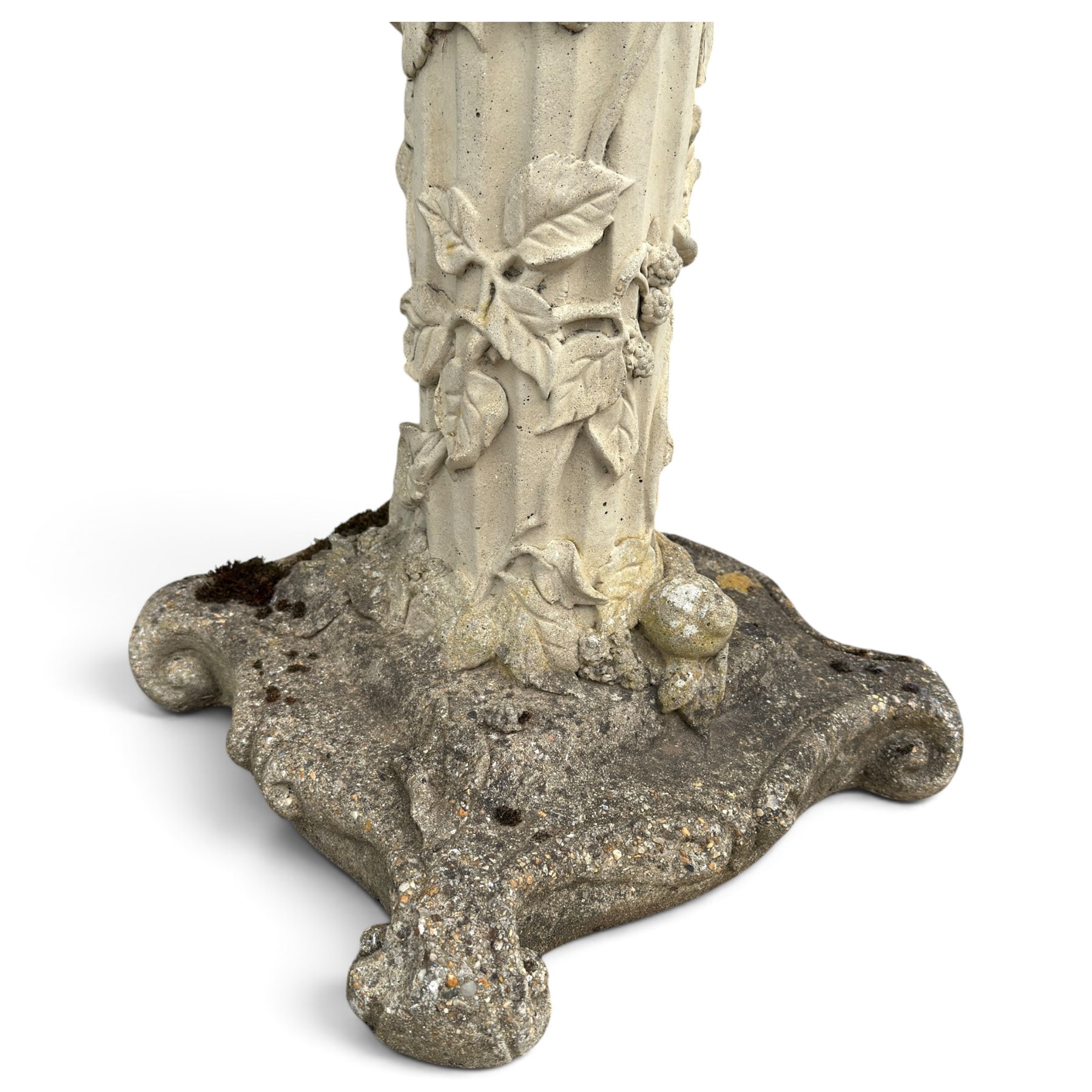 Weathered cast stone birdbath, the kylix shaped bowl with fluted body, raised on a fruiting foliate vine decorated fluted pedestal with upper knop and bird and fieldmouse motifs, shaped square base with scroll feet