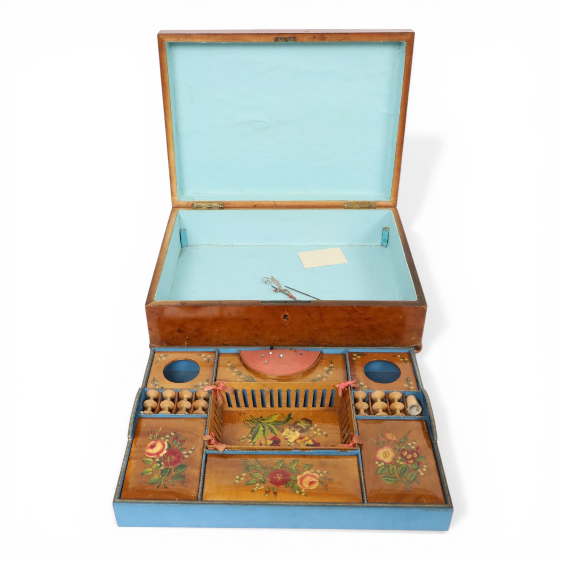 19th century satinwood sewing box, of rectangular form, the hinged cover with foliate decoration opening to reveal a removable compartmented tray with pin cushion, bobbins and removable central basket, painted with violas, upon compressed bun feet, H13cm L39cm D29cm
