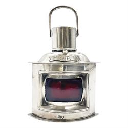 Early 20th century silver novelty inkwell, modelled as a ship's port lantern, with swing handle, convex red glass panel and hinged cover opening to reveal a glass liner, hallmarked Samuel Jacob, London 1911, height not including handle H8.5cm