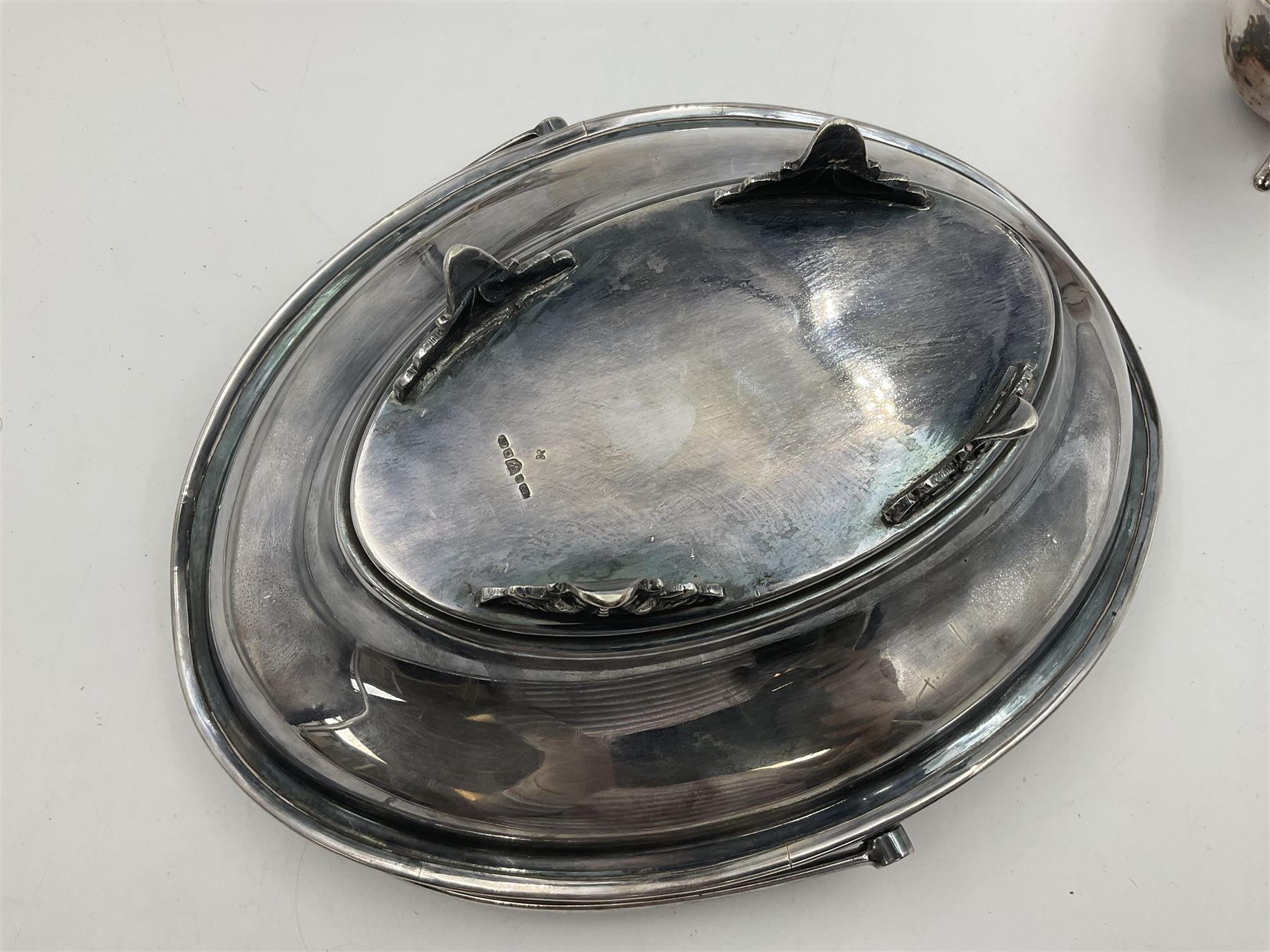 Silver plated seven bar toast rack by Mappin & Webb, together with other silver plated items including pair of bottle coasters, swing handled baskets and two sauce boats