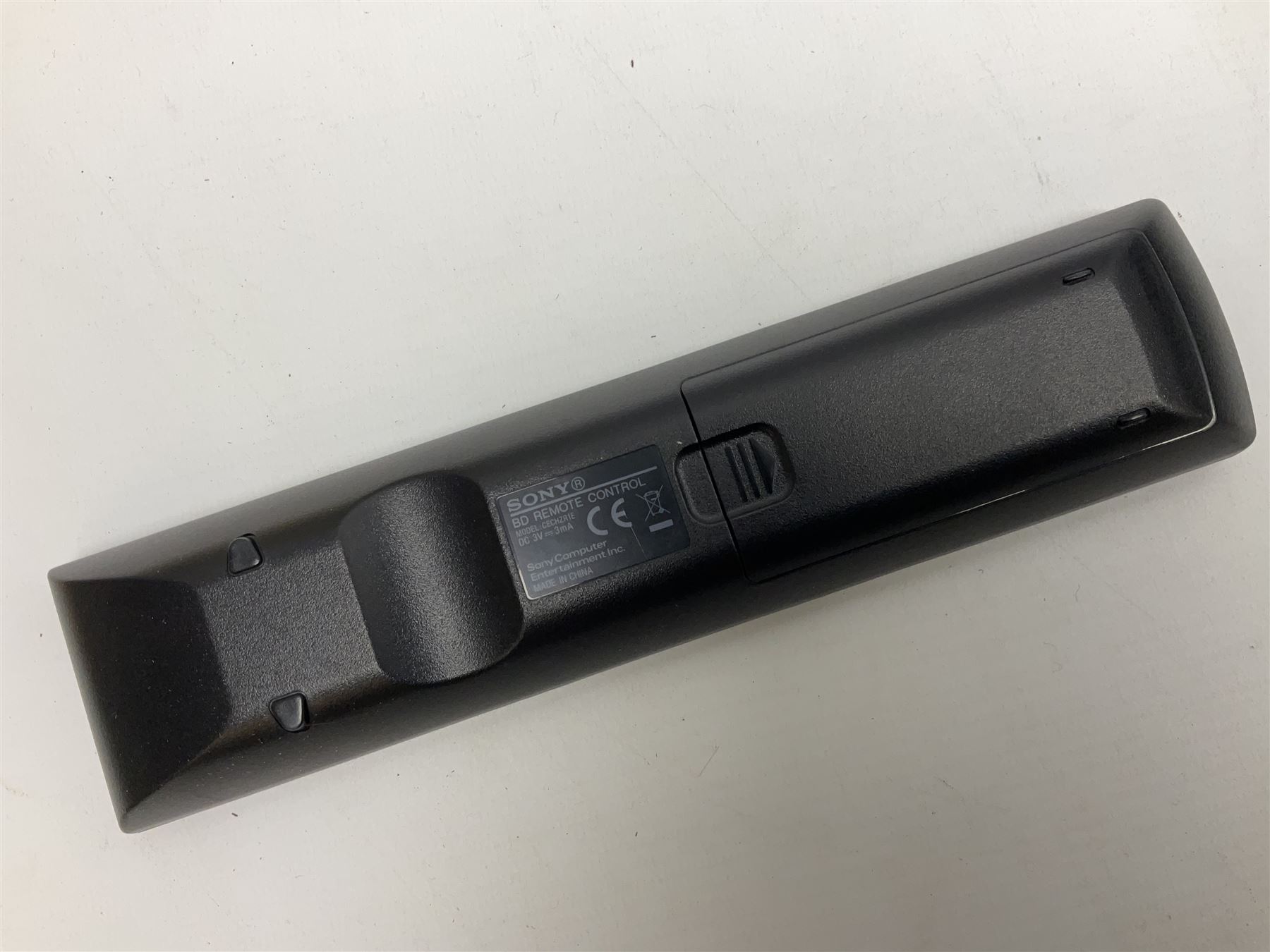 Sony PlayStation 3 60GB console with one PS3 controller, two PS2 controllers, BD remote control, PSP handheld gaming console with case, GAMEware PSP essentials pack, and a selection of PS2, PS3 and PSP games in original cases with instruction booklets 