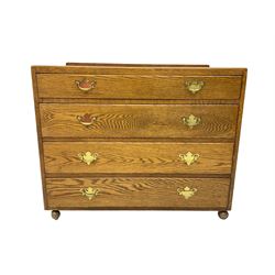 Mid-20th century oak chest, raised back, fitted with four graduating drawers, on castors