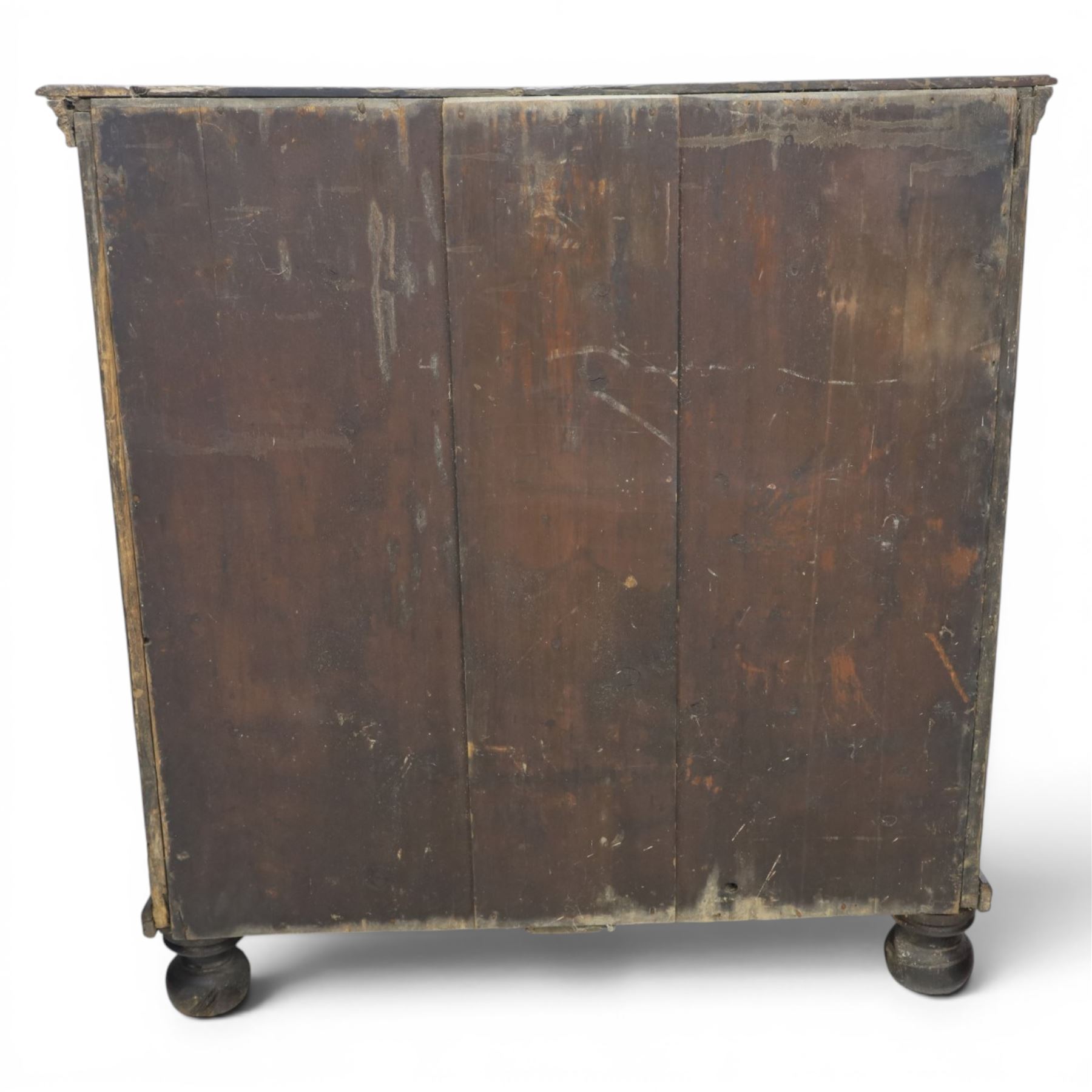 Late 17th century moulded front oak chest of drawers, rectangular plank top. above two banks of four graduated drawers, central escutcheons and drop handles, on squat bun feet