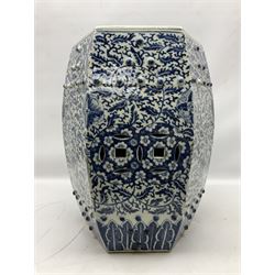 Chinese blue and white garden seat, of hexagonal barrel form, profusely decorated with flower heads and scrolling foliate vines above a lower stiff leaf border, seat D27cm overall H46.5cm