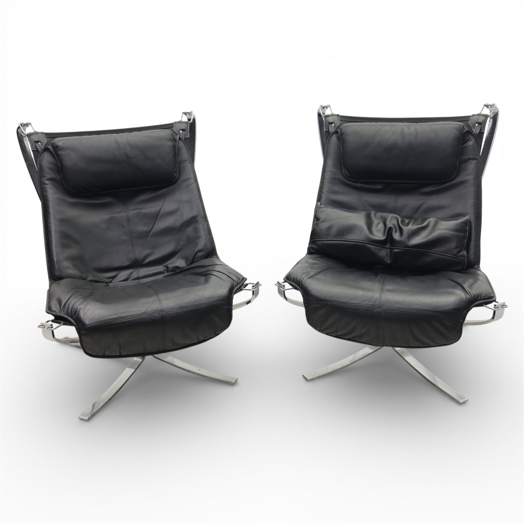Pair of modernist black leather and chrome armchairs, in the manner of  Vatne Møbler, black leather sling seats suspended within chromed steel brackets, supported by polished chrome cross bases