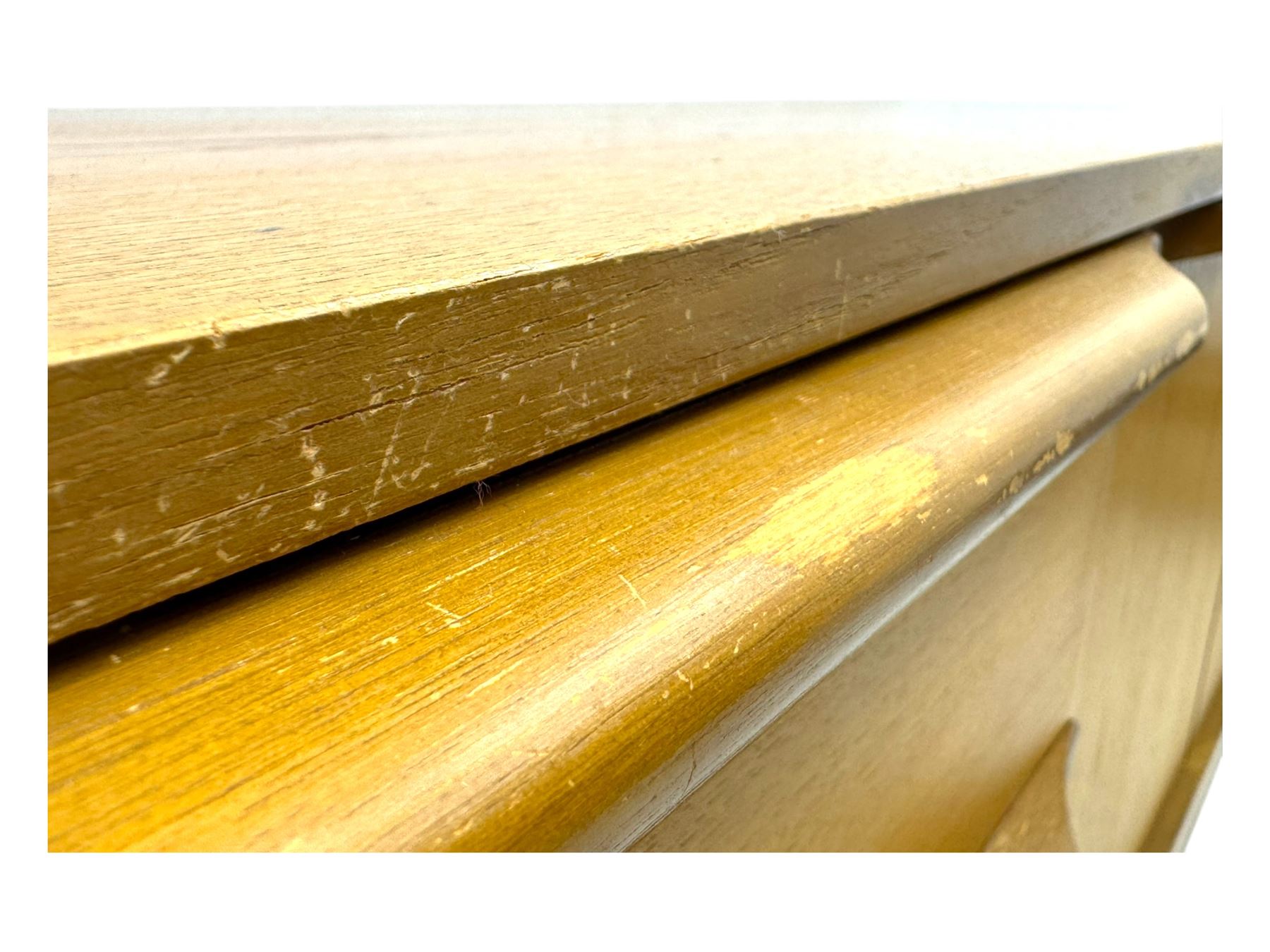 Mid-20th century teak sideboard, fitted with a fall-front cupboard, three drawers including a green baize-lined cutlery drawer, and a double cupboard, with integrated handles, on sleigh supports