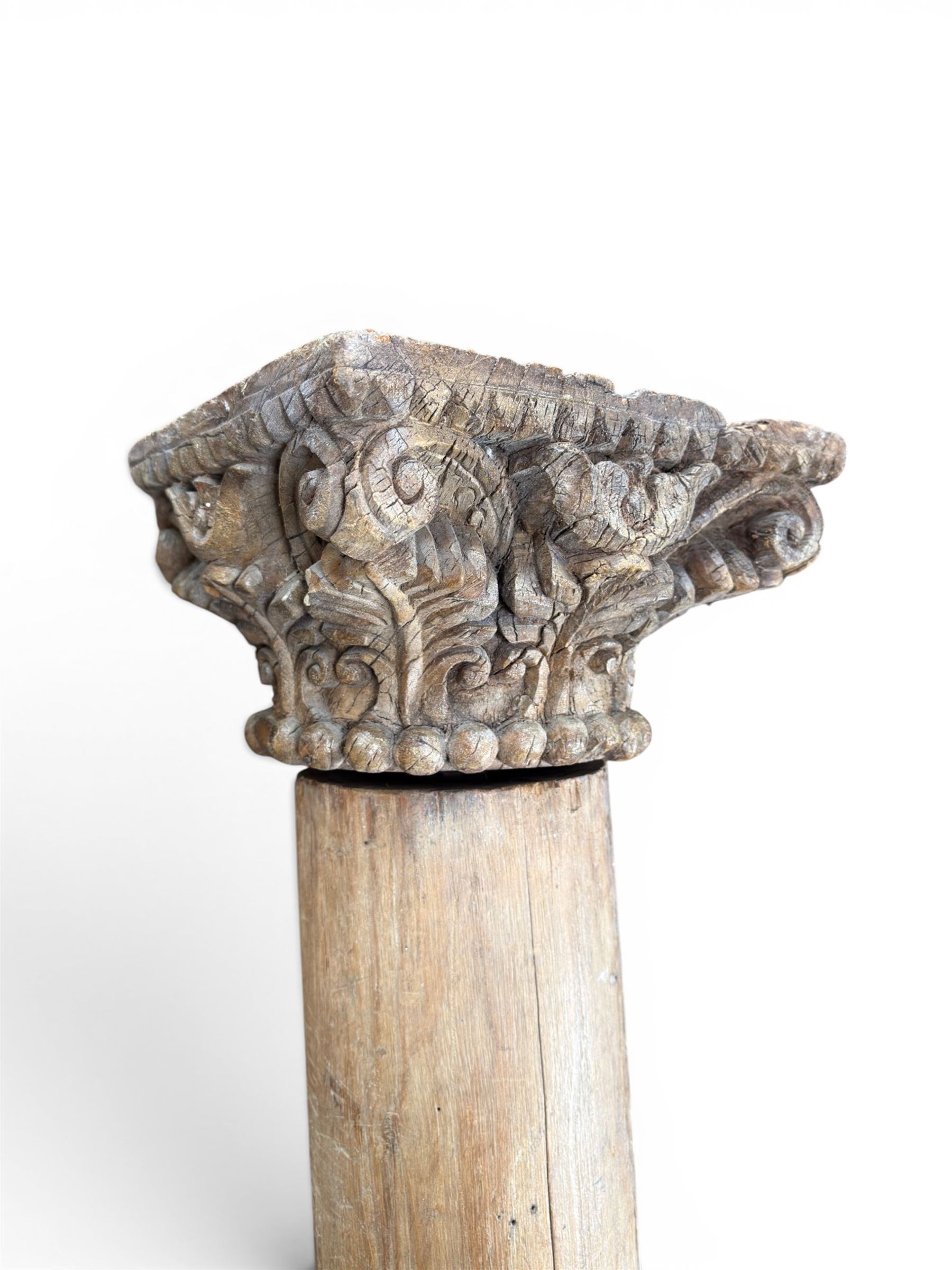 Matched pair of 19th century hardwood architectural columns with carved capitols, column diameter 18cm