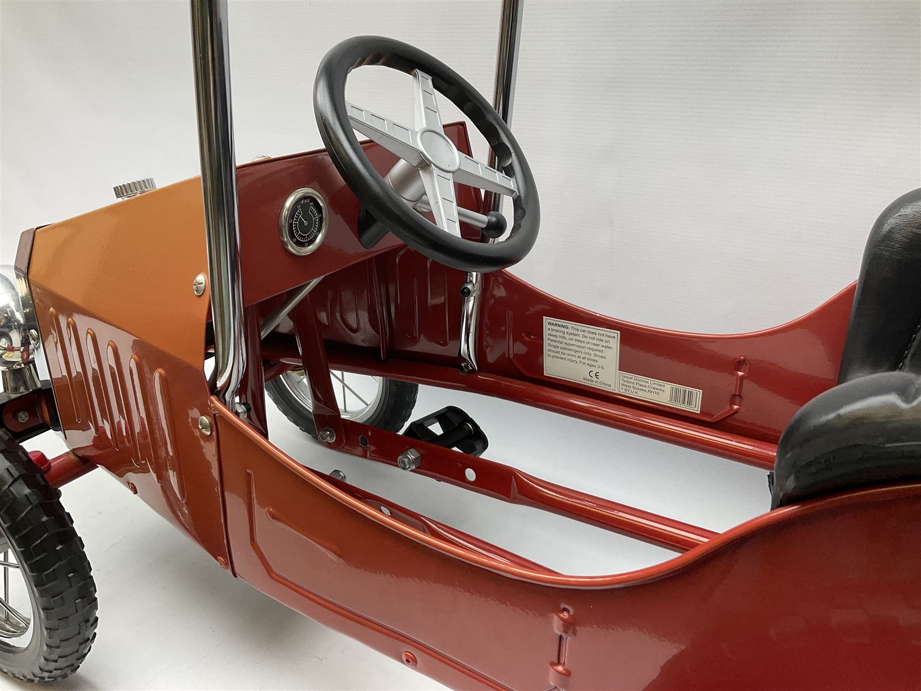 Red child's tin-plate pedal car with chrome detail, by Posh Paddles, Scarborough, H56cm, L80cm