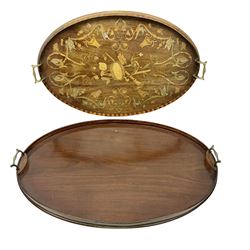 Edwardian twin handled oval marquetry tray, inlaid with instruments, putti, C scrolls and florals, with brass twin handles, together with a similar oval twin handled plain mahogany tray, largest W70cm